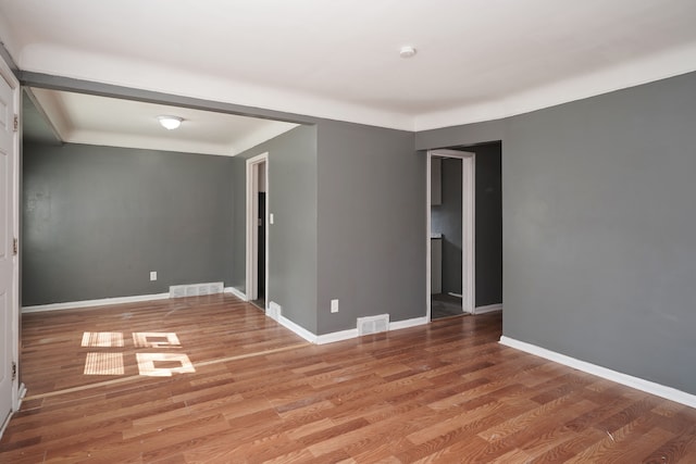 empty room featuring hardwood / wood-style floors