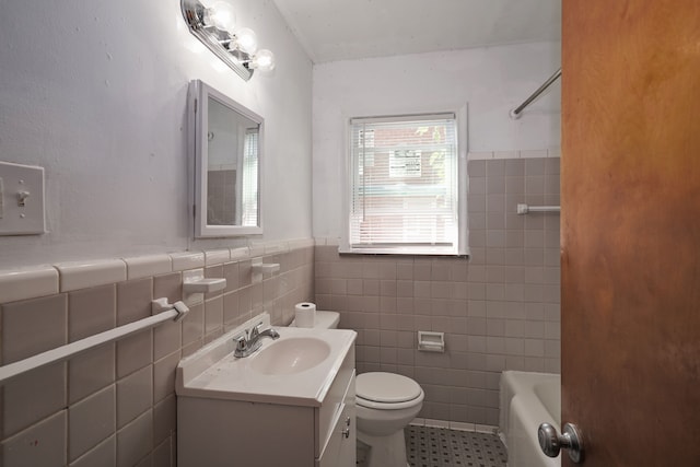 bathroom featuring tile patterned flooring, vanity, tile walls, and toilet