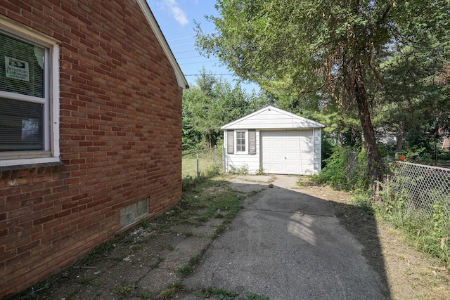 view of home's exterior with an outdoor structure and a garage