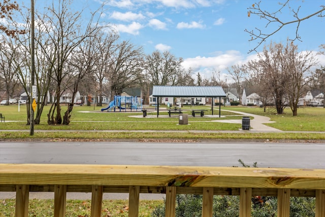 exterior space with a yard and a playground