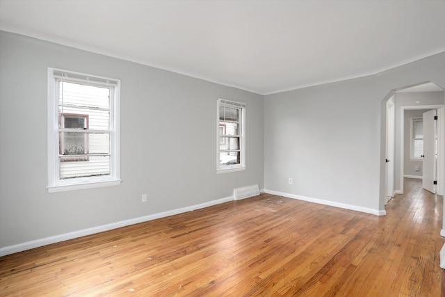 empty room with light hardwood / wood-style floors