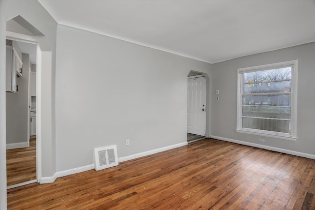 spare room with hardwood / wood-style floors