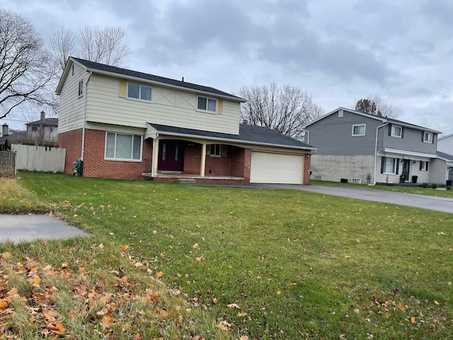 front of property featuring a garage and a front lawn