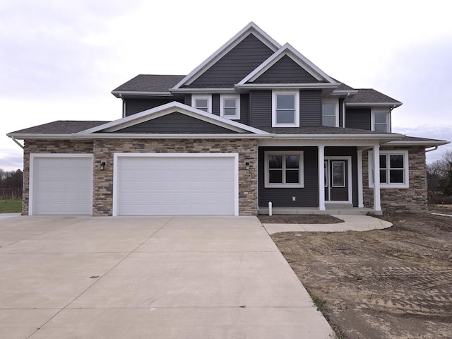 2412 Ulrich Ln, Stevensville, MI 49127 - view of front of property featuring covered porch and a garage