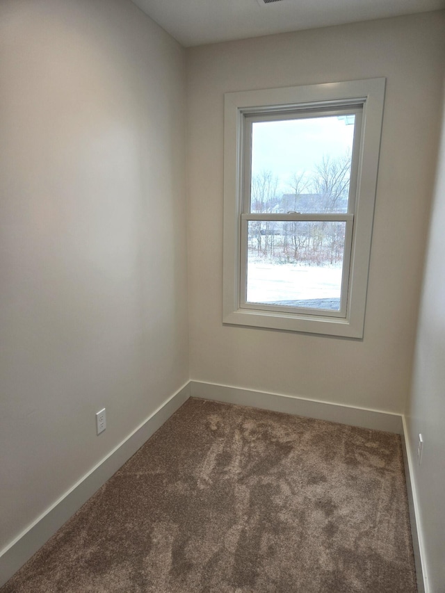 empty room featuring carpet floors