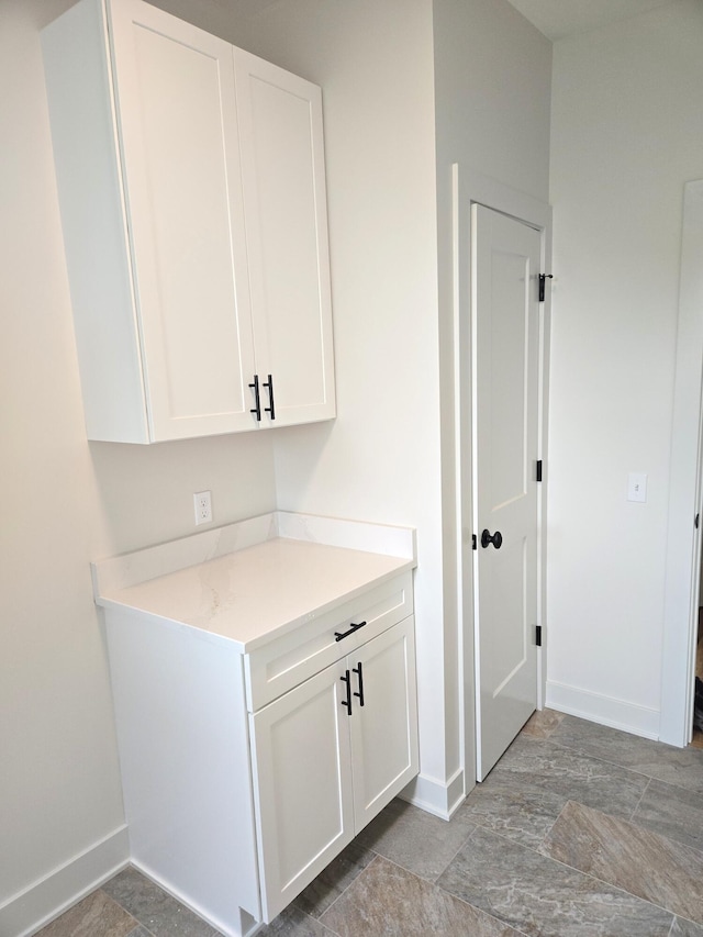 bar with white cabinetry