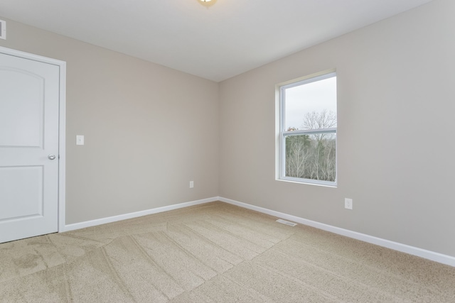 spare room with carpet