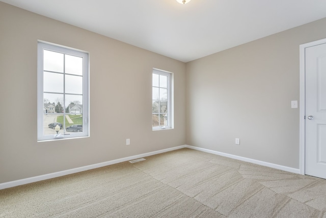 unfurnished room with carpet floors