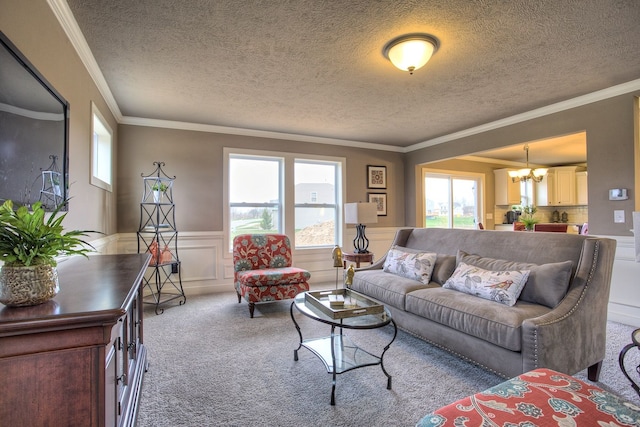 living room featuring light carpet, a chandelier, and ornamental molding