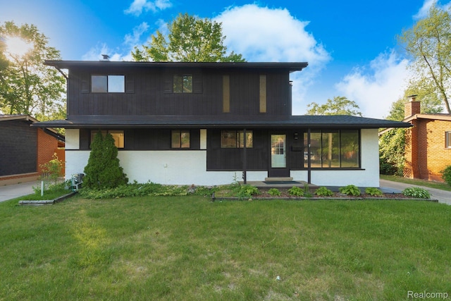 11357 Erdmann Rd, Sterling Heights, MI 48314 - view of front of house with a front yard and brick siding