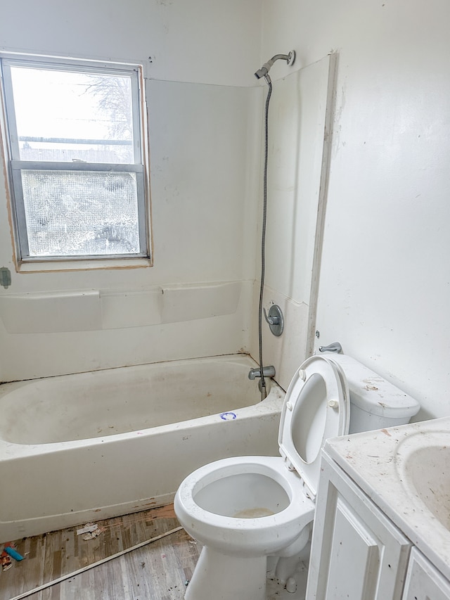 full bathroom featuring hardwood / wood-style flooring, vanity, toilet, and shower / bath combination