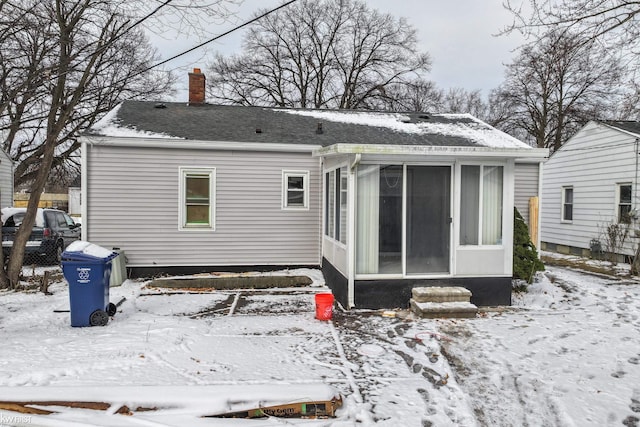 view of snow covered house