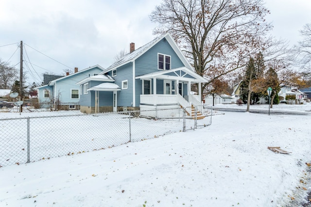 view of snow covered house