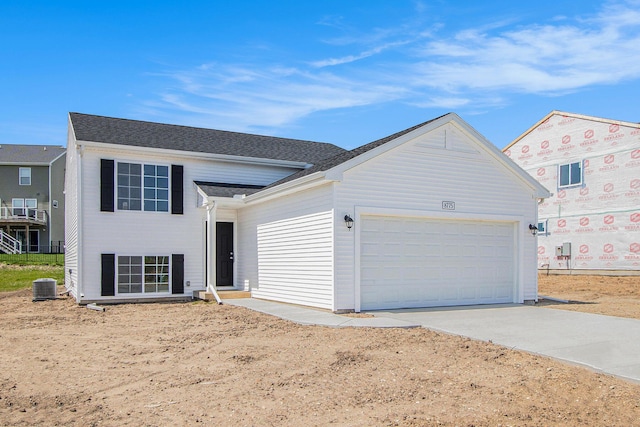 8775 E Sturtevant Ave, Richland, MI 49083 - view of front facade with central air condition unit, driveway, and a garage