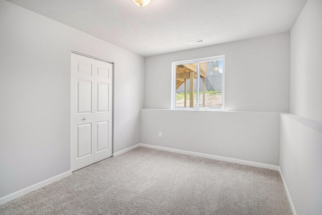 8775 E Sturtevant Ave, Richland, MI 49083 - empty room featuring carpet floors and baseboards