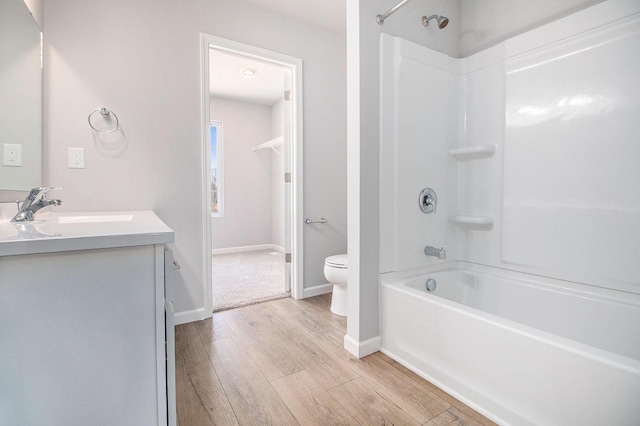 8775 E Sturtevant Ave, Richland, MI 49083 - full bathroom with toilet, wood finished floors, vanity,  shower combination, and baseboards