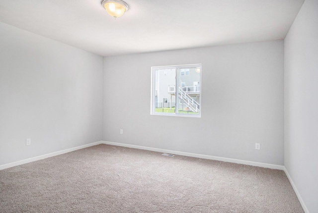 8775 E Sturtevant Ave, Richland, MI 49083 - spare room featuring carpet flooring and baseboards
