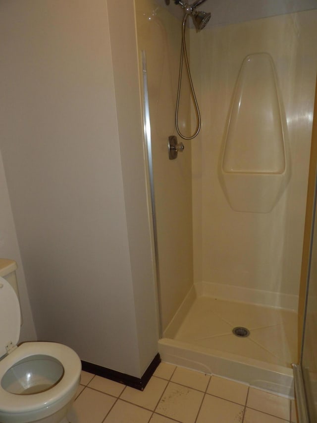 7335 Colony Dr, West Bloomfield, MI 48323 - bathroom featuring tile patterned floors, toilet, and walk in shower