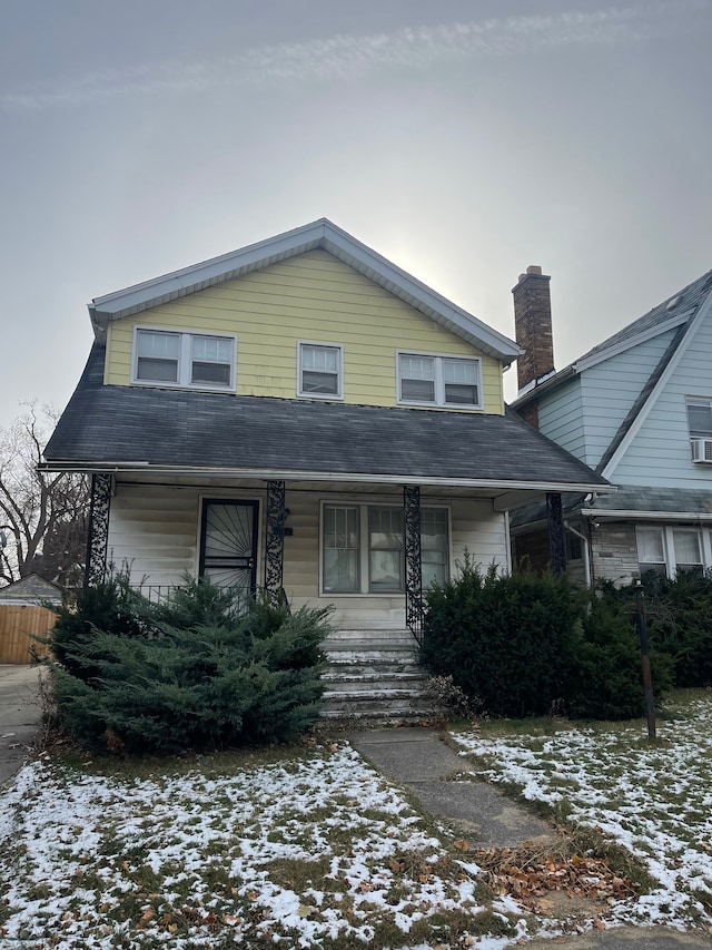 view of front property featuring covered porch