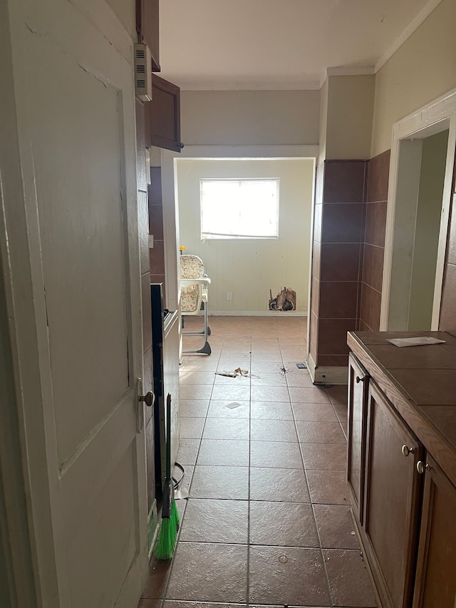 bathroom featuring tile patterned flooring and tile walls