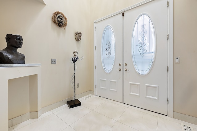 entrance foyer featuring light tile patterned floors