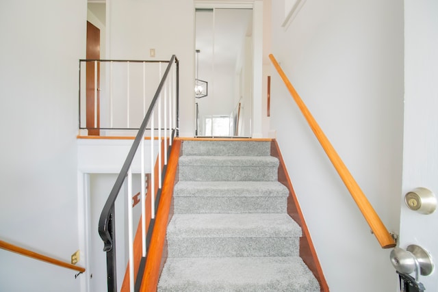 staircase featuring hardwood / wood-style floors