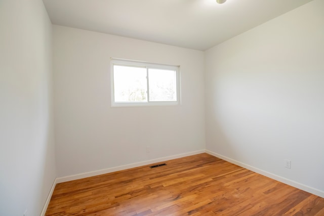 spare room with light hardwood / wood-style floors