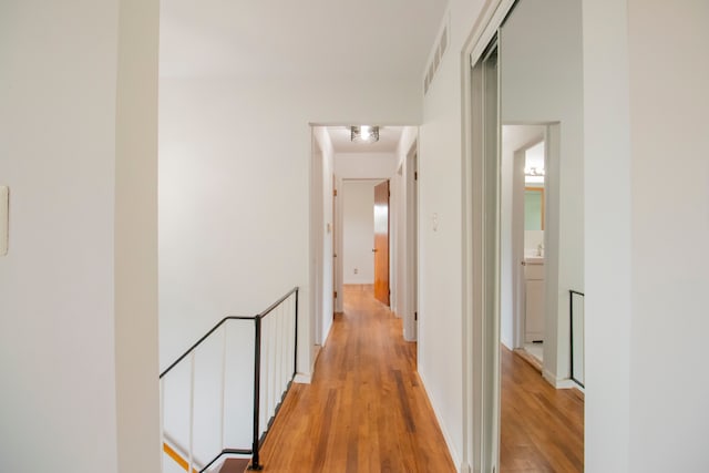 hallway with light wood-type flooring