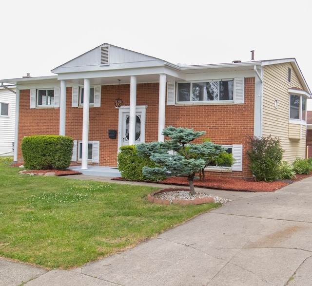 view of front of property with a front lawn