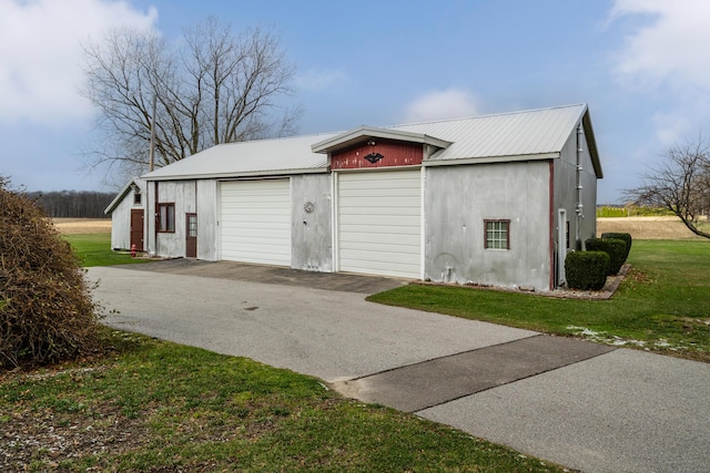 garage with a yard