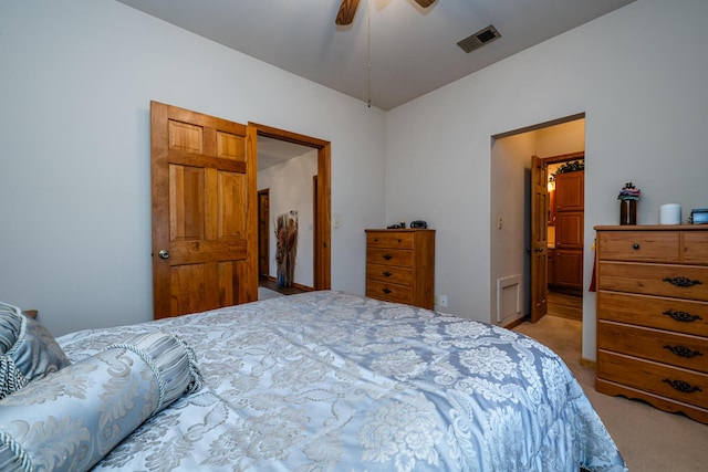 bedroom with light carpet and ceiling fan