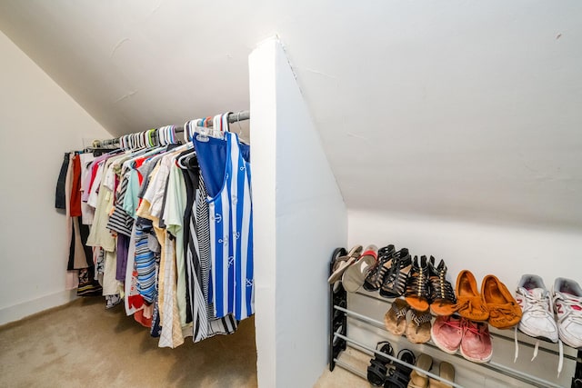 walk in closet with carpet flooring