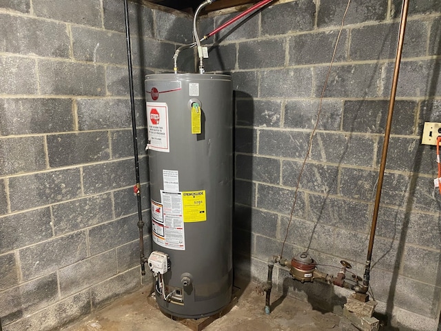 utility room featuring gas water heater