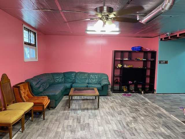 living room with ceiling fan and hardwood / wood-style floors