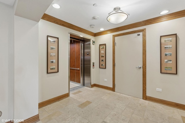 200 Lake St Unit 3B, Saint Joseph, MI 49085 - hall with elevator, ornamental molding, recessed lighting, and stone tile floors