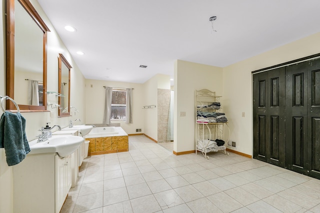 9078 N Ferris Ave, Bitely, MI 49309 - full bathroom with a bath, vanity, tile patterned flooring, baseboards, and recessed lighting