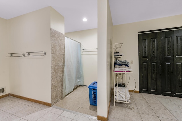 9078 N Ferris Ave, Bitely, MI 49309 - bathroom featuring tile patterned floors, a shower with shower curtain, baseboards, and recessed lighting