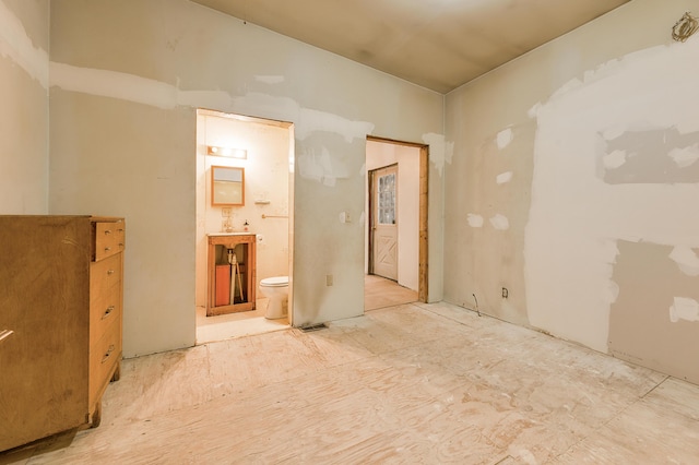 9078 N Ferris Ave, Bitely, MI 49309 - unfurnished bedroom with connected bathroom