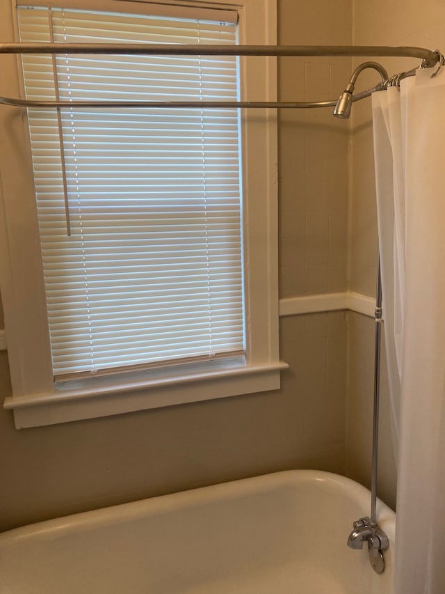 3918 Nottingham Rd, Detroit, MI 48224 - bathroom featuring a freestanding tub and a shower with shower curtain