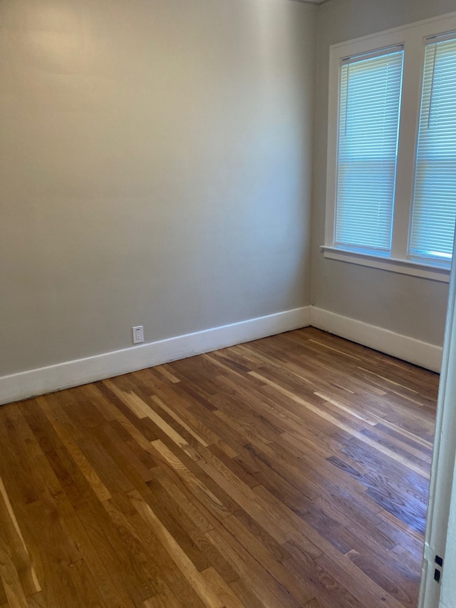 spare room featuring hardwood / wood-style floors