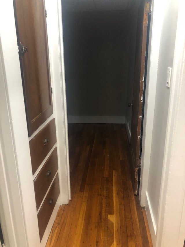 hall with dark hardwood / wood-style floors