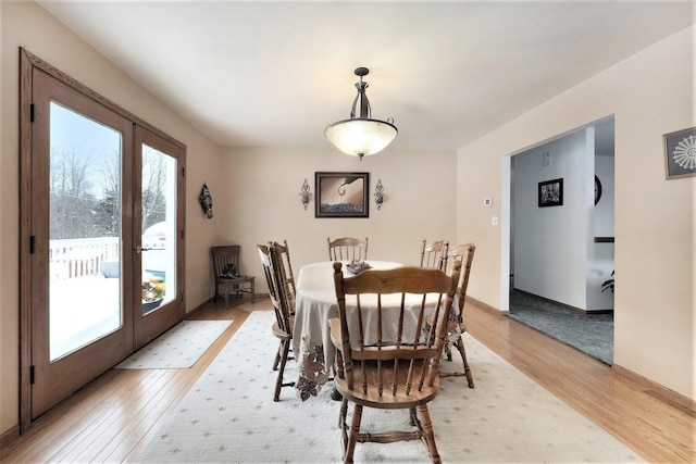 7580 River Rd, Evart, MI 49631 - dining area featuring french doors and light wood-style floors