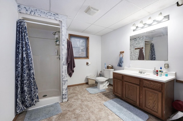 7580 River Rd, Evart, MI 49631 - bathroom featuring a paneled ceiling, vanity, and a shower stall