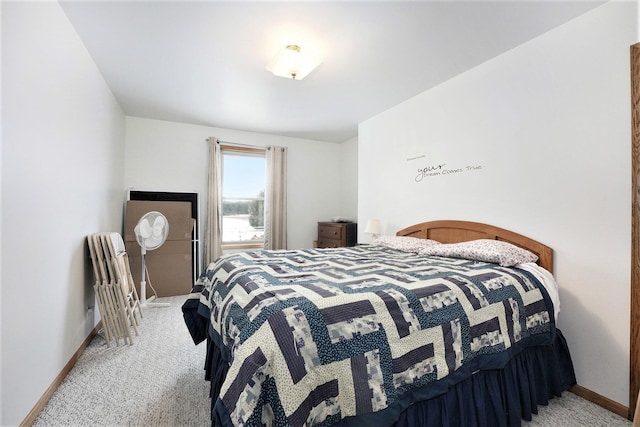 7580 River Rd, Evart, MI 49631 - bedroom with light carpet and baseboards