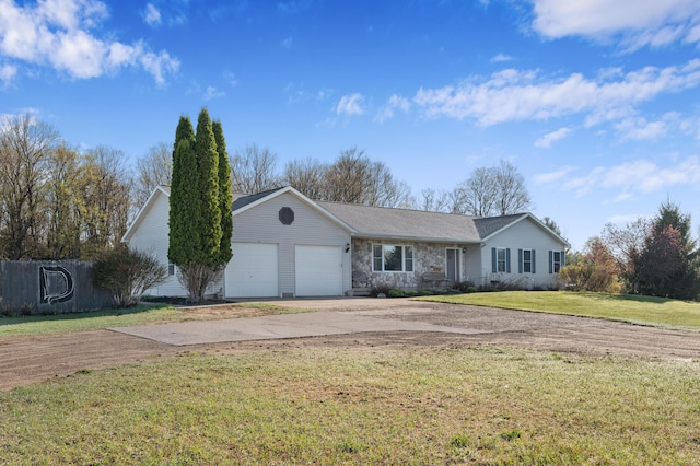 7580 River Rd, Evart, MI 49631 - ranch-style home featuring concrete driveway, a garage, stone siding, and a front yard
