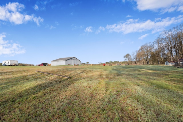 7580 River Rd, Evart, MI 49631 - view of green lawn with a view of rural / pastoral area and an outbuilding