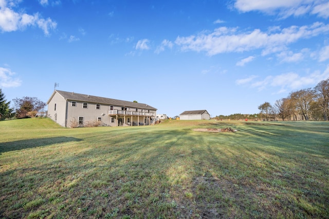 7580 River Rd, Evart, MI 49631 - view of grassy yard with a wooden deck