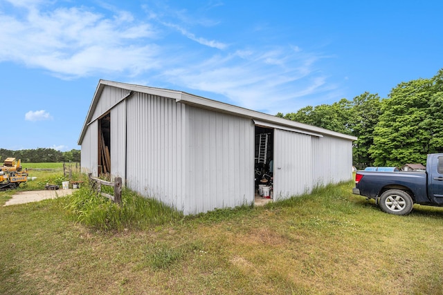 7580 River Rd, Evart, MI 49631 - view of property exterior featuring an outbuilding, a lawn, and an outdoor structure