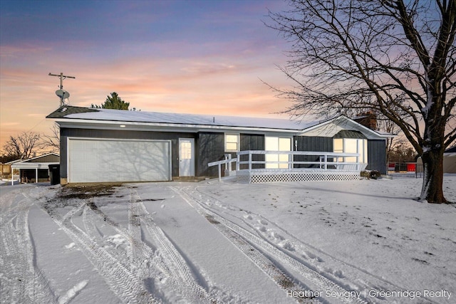 ranch-style home featuring a garage