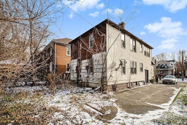 view of snow covered property